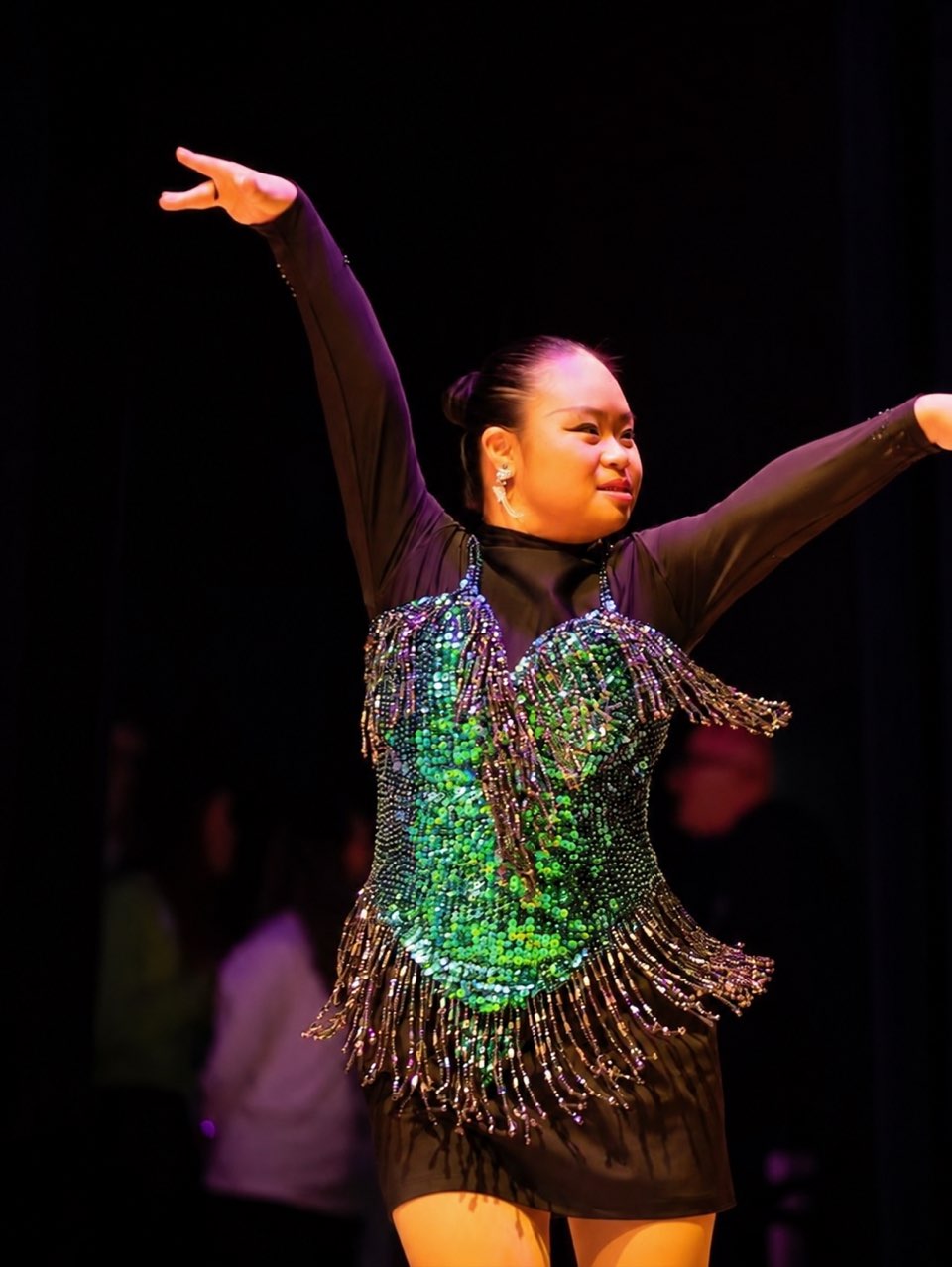 Megan Tang dancing with arms raised, Special Olympics World Winter Games, Turin 2025